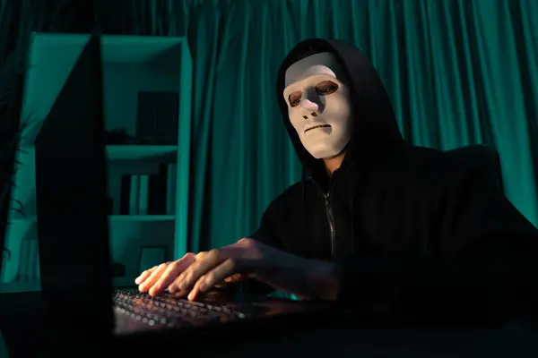 ホワイト犯罪者の匿名マスクは ハックをプログラミングすることによって暗号化パスワードをインストールし 会社への身代金のためのコンピュータ上の膨大なデータベースを取る安全な徹底的なプライバシーを作成しようとします ペクニャーリ — ストック写真