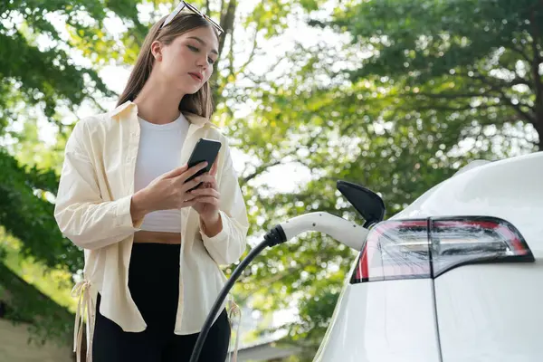 Young Woman Use Smartphone Pay Electricity Public Car Charging Station — Stock Photo, Image