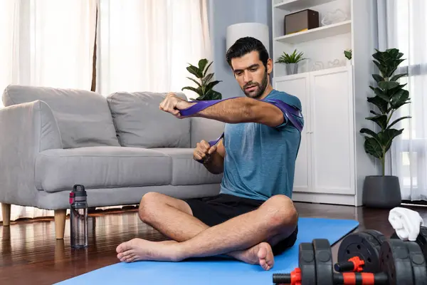 Athletic Sporty Man Pulling Resistance Band Exercise Home Workout Exercise — Stock Photo, Image