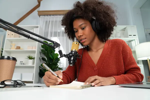 stock image Host channel of beautiful African woman talking in online broadcast teaching marketing influencer, with listeners in broadcast or online. Concept of anywhere at work place. Tastemaker.