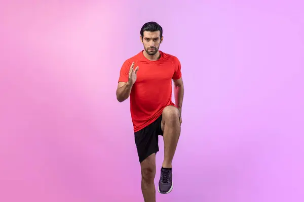 Full body length gaiety shot athletic and sporty young man fitness running cardio exercise posture on isolated background. Healthy active and body care lifestyle.