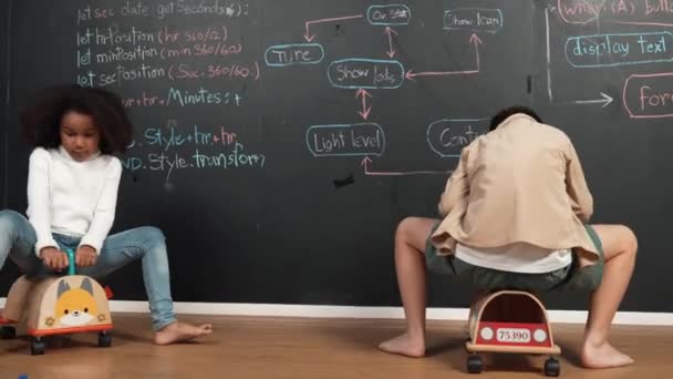 Diverse Children Drive Car Toy Blackboard Engineering Prompt Coding Program — Stock Video