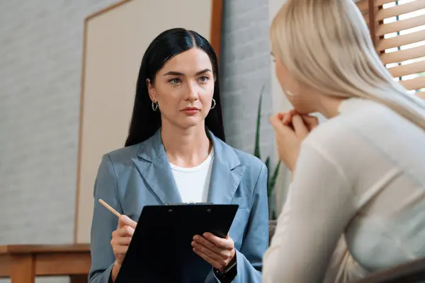 stock image Psychological consultation on mental health or seeking help from professional, young patient on therapy session while psychiatrist making diagnostic on mental illness. Mental treatment session. Blithe