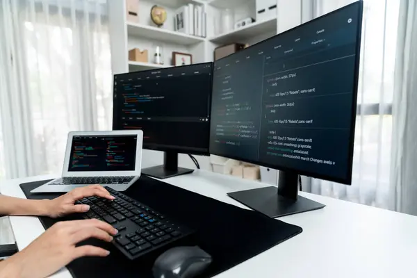Cropped hands image of IT developer creating with typing information on pc with coding program information data website application, wearing jeans shirt surround safety analysis two screen. Stratagem.