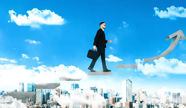 Business man climb up stair steps to career success with business district and horizon skyline as background. Concept of business goal success, growth of career path and starting up new business. uds
