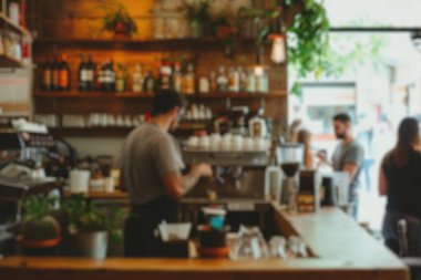 Kalabalık bir kahvehanenin arka planında bulanıklık vardı. Müşteriler içkilerini yudumluyor, baristalar kahve yapıyor, hareketli bir mekan yaratıyorlardı. Saygıdeğer.