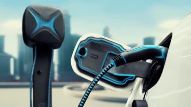 Elektrikli araba şarj istasyonuna bağlanır ve şehrin arka planında gelişmiş EV şarj cihazıyla şarj edilir. Gelecekteki yenilikçi çevre dostu enerji sürdürülebilirliği CO2 emisyonunu azaltmak için. İnceleyin