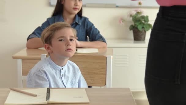Bored Elementary Student Looking Teacher While Attend Classroom Diverse Smart — Stock Video