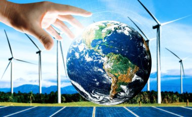 Alternatif enerji ile sürdürülebilirlik gelişimi kavramı. Çevre dostu rüzgar türbini çiftliği ve arka planda yeşil yenilenebilir enerji olan gezegenle insan eli ilgilenir. uds