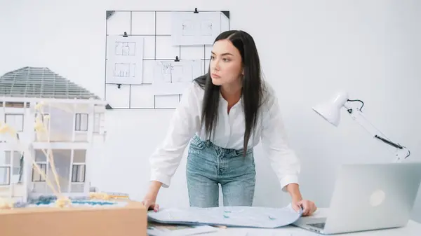 Young Beautiful Caucasian Architect Puts Blueprint Table Compare House Model — Stock Photo, Image