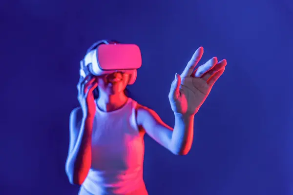 Smart Female Standing Surrounded Cyberpunk Neon Light Wear Headset Connecting — Stock fotografie