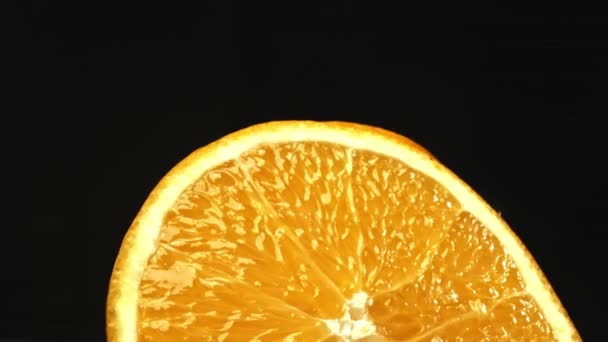 Macrography Capture Orange Slice Placed Sleek Isolated Black Backdrop Unfolds — Stock Video