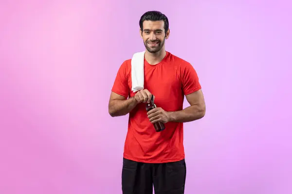 Full body length gaiety shot athletic and sporty young man with towel and drinking water in fitness exercise posture on isolated background. Healthy active and body care lifestyle.