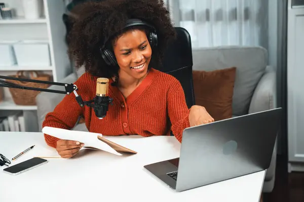 stock image Host channel of beautiful African woman talking in online broadcast teaching marketing influencer, with listeners in broadcast or online. Concept of anywhere at work place. Tastemaker.