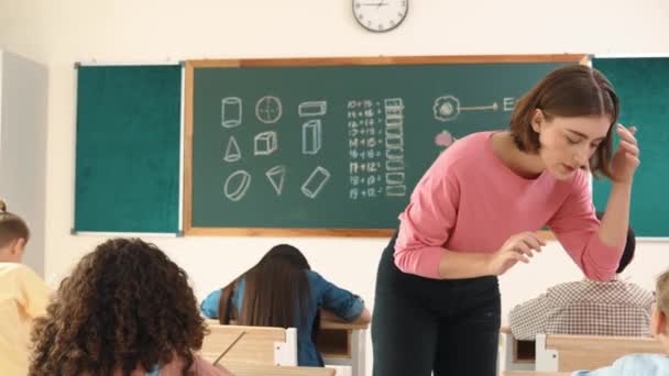 Smart Teacher Checking Cute Student Homework While Explaining Idea Class — Stock Video