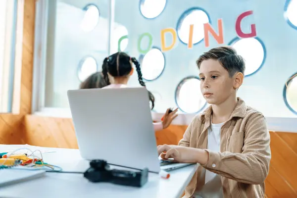 Schoolboy Classroom Sitting Learning Engineering Remote Control Laptop While Other — Stock Photo, Image