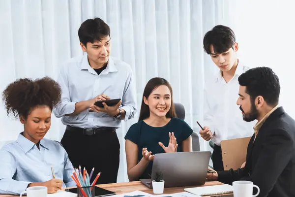 stock image Happy diverse business people work together, discussing in corporate office. Professional and diversity teamwork discuss business plan on desk with laptop. Modern multicultural office worker. Concord