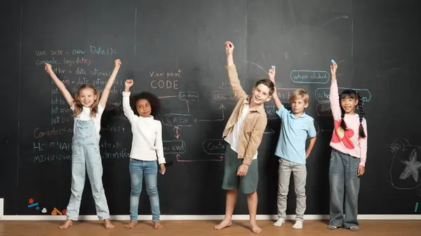 Diverse Student Raised Hands While Standing Blackboard Written Engineering Prompt Stock Image
