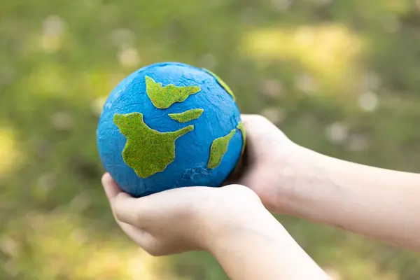 Young Boys Hand Holding Planet Earth Globe Natural Park Background — Stock Photo, Image