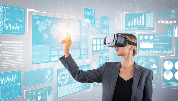 Skilled business woman pointing at financial data while wearing VR glasses. Professional project manager looking at marketing strategy while connecting with metaverse and visual reality. Contraption.