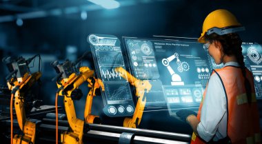 Sanayi 4.0 veya 4. endüstriyel devrimin otomasyon üretim sürecini ve IOT yazılımını gösteren dijital fabrika üretim teknolojisi için MLP Smart Industry robot kolları.