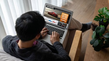 car rental website on computer screen for tourist to rent a car for transportation snugly