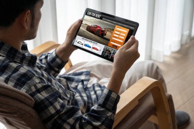 car rental website on computer screen for tourist to rent a car for transportation snugly