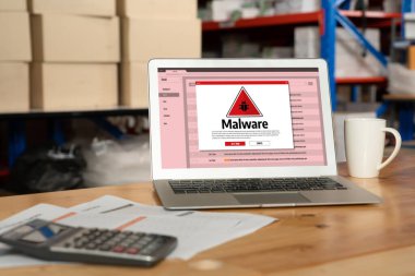 Cyber attacking concept. Malware alert showing on computer screen display scam and threat detection on computer system or online server to be removed snugly.