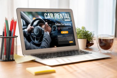 car rental website on computer screen for tourist to rent a car for transportation snugly