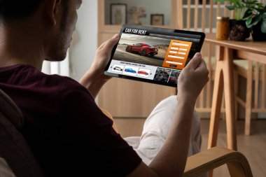 car rental website on computer screen for tourist to rent a car for transportation snugly