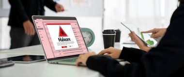 Cyber attacking concept. Malware alert showing on computer screen display scam and threat detection on computer system or online server to be removed snugly.
