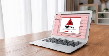 Cyber attacking concept. Malware alert showing on computer screen display scam and threat detection on computer system or online server to be removed snugly.