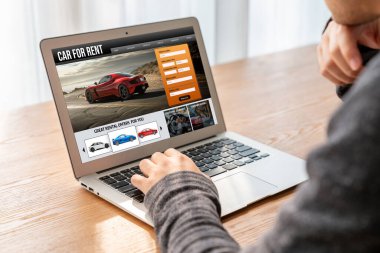 car rental website on computer screen for tourist to rent a car for transportation snugly