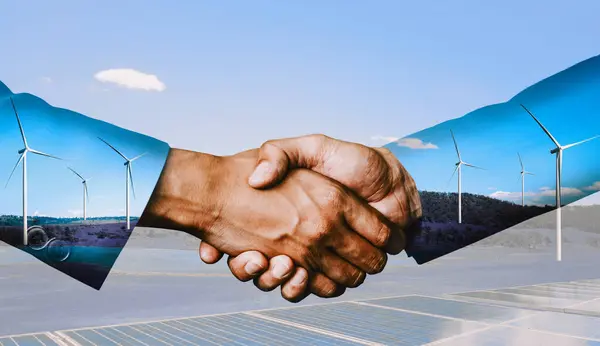 stock image Double exposure graphic of business people handshake over wind turbine farm and green renewable energy worker interface. Concept of sustainability development by alternative energy. uds