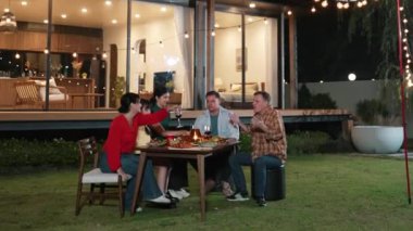 Family together for holiday celebration in garden. Family member gather have dinner. Outdoor picnic activity to relax with food and spend time with cute relatives cross generation gap. Divergence.