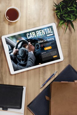 car rental website on computer screen for tourist to rent a car for transportation snugly