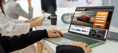 car rental website on computer screen for tourist to rent a car for transportation snugly