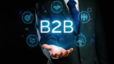 İş adamı B2B peyzajında geziniyor, iş-iş bağlantılarını geliştirmek için kullanım teknolojisi kullanıyor. B2B etkileşimini yeniden şekillendiren keşifler, iş-iş stratejilerinde yenilikleri yönlendiren araçlar. Kullanıcı Kimliği
