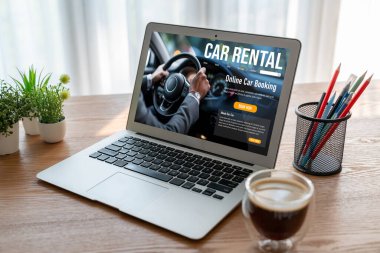 car rental website on computer screen for tourist to rent a car for transportation snugly