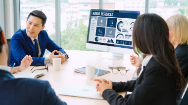 Human resources management software on computer screen helping human resources employee to manage recruitment, payroll, staff searching and KPI evaluation snugly