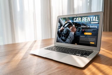 car rental website on computer screen for tourist to rent a car for transportation snugly