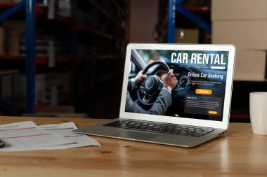 car rental website on computer screen for tourist to rent a car for transportation snugly