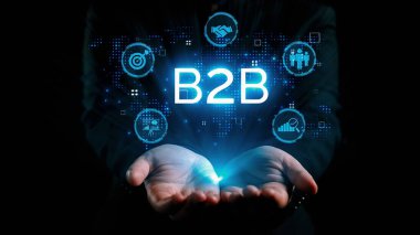 İş adamı B2B peyzajında geziniyor, iş-iş bağlantılarını geliştirmek için kullanım teknolojisi kullanıyor. B2B etkileşimini yeniden şekillendiren keşifler, iş-iş stratejilerinde yenilikleri yönlendiren araçlar. Kullanıcı Kimliği