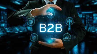 İş adamı B2B peyzajında geziniyor, iş-iş bağlantılarını geliştirmek için kullanım teknolojisi kullanıyor. B2B etkileşimini yeniden şekillendiren keşifler, iş-iş stratejilerinde yenilikleri yönlendiren araçlar. Kullanıcı Kimliği