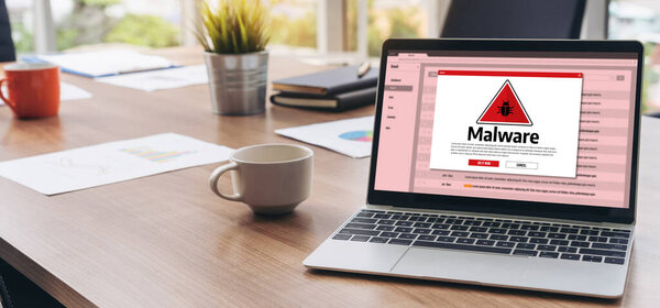 Cyber attacking concept. Malware alert showing on computer screen display scam and threat detection on computer system or online server to be removed snugly.