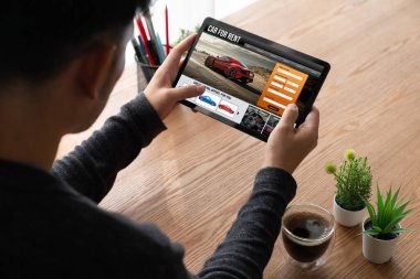 car rental website on computer screen for tourist to rent a car for transportation snugly
