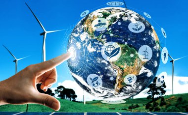 Alternatif enerji ile sürdürülebilirlik gelişimi kavramı. Çevre dostu rüzgar türbini çiftliği ve arka planda yeşil yenilenebilir enerji olan gezegenle insan eli ilgilenir. uds