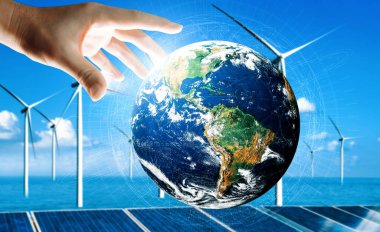 Alternatif enerji ile sürdürülebilirlik gelişimi kavramı. Çevre dostu rüzgar türbini çiftliği ve arka planda yeşil yenilenebilir enerji olan gezegenle insan eli ilgilenir. uds