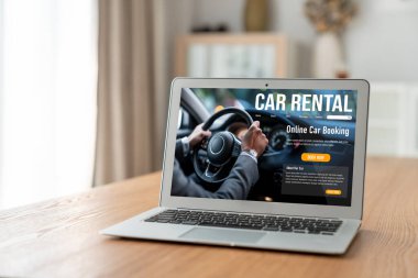 car rental website on computer screen for tourist to rent a car for transportation snugly