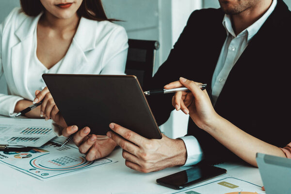 Businessman is in meeting discussion with colleague businesswomen in modern workplace office. People corporate business team concept. uds